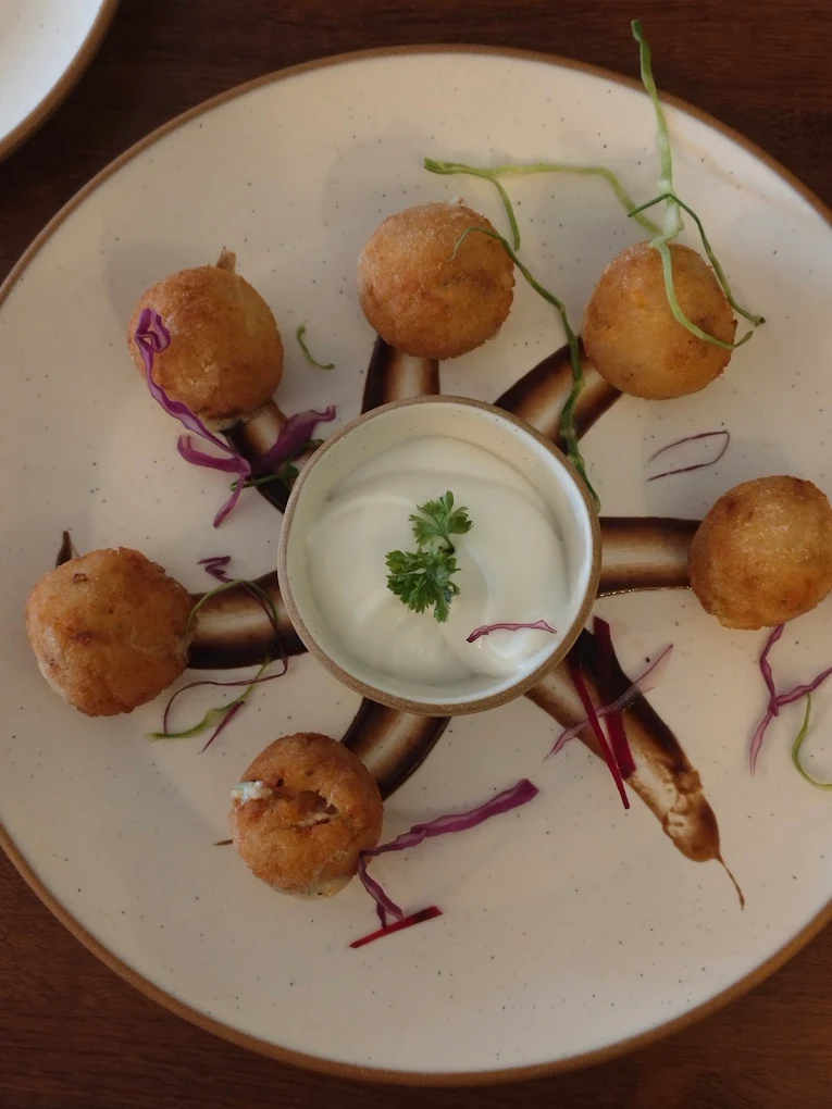 Crispy cheese corn balls at The Cosmo