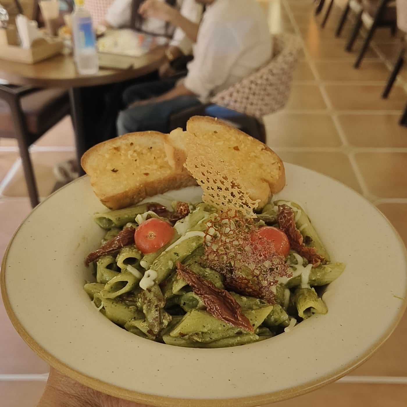 Pesto pasta with sun-dried tomatoes at The Cosmo