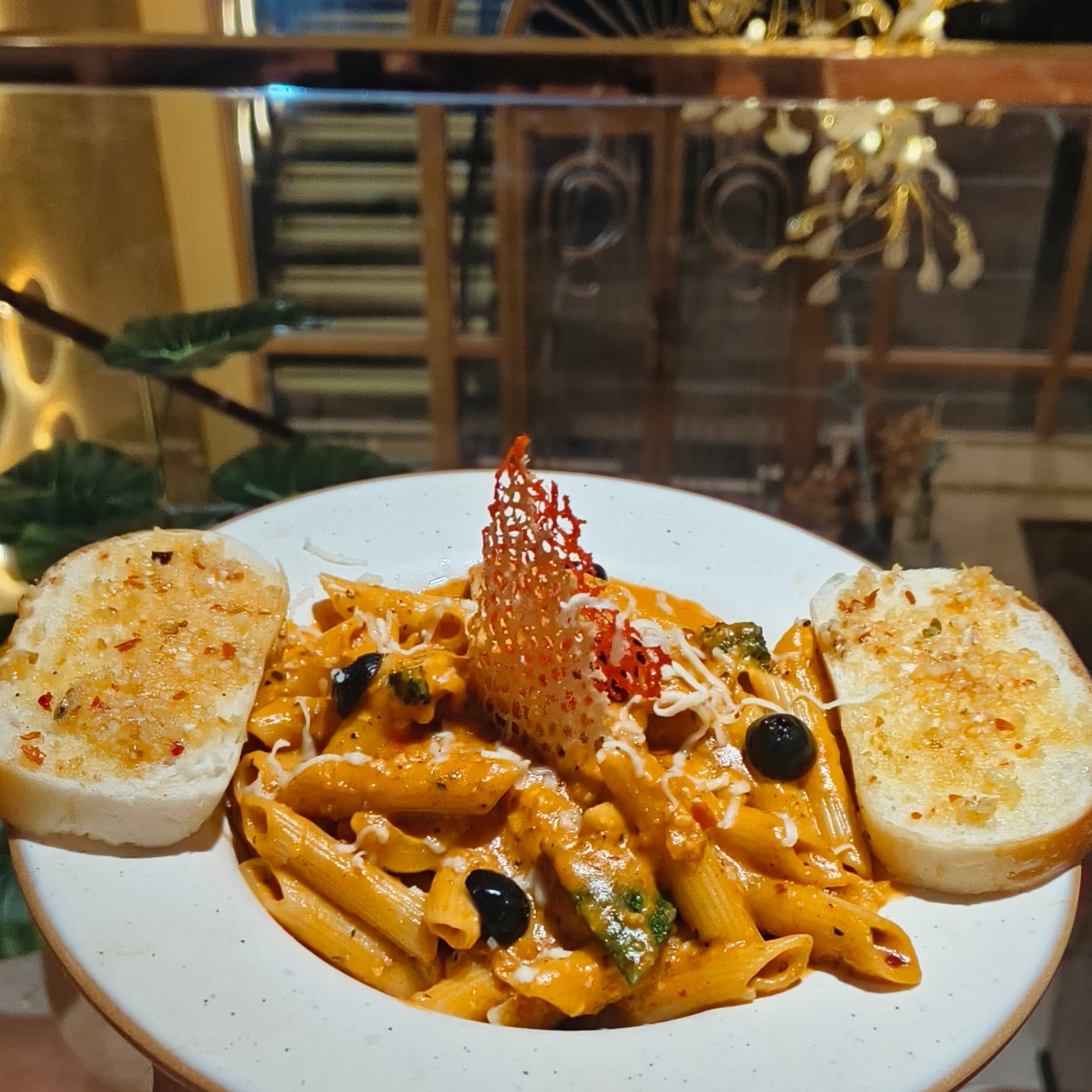Rose pasta with garlic bread at The Cosmo