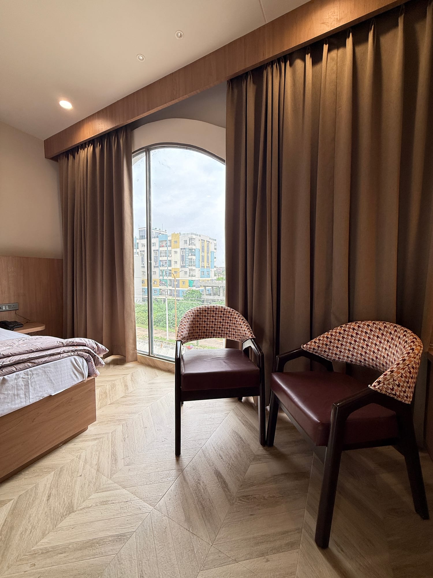 Lounge seating beside the arched window at The Cosmo