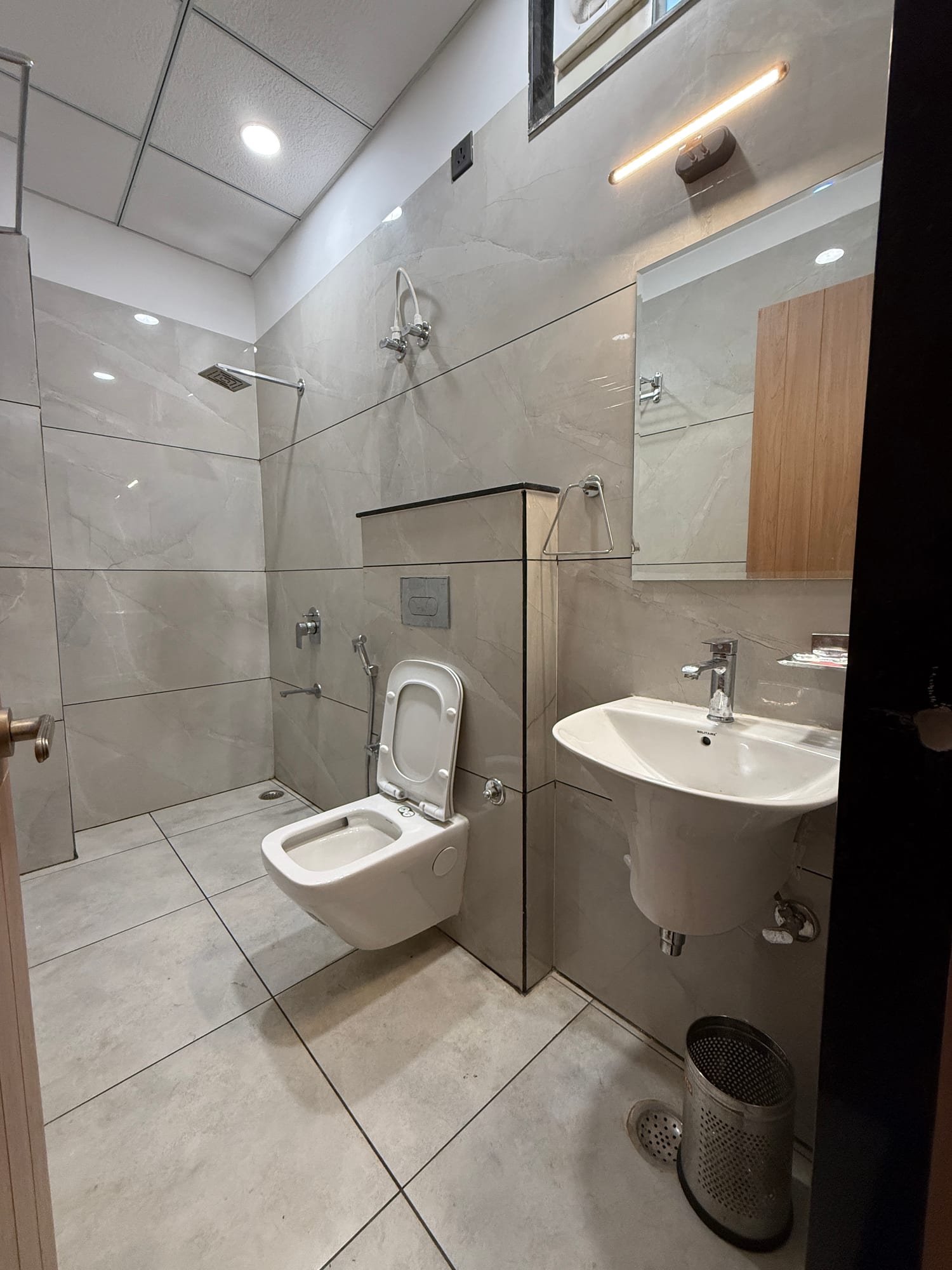 Attached bathroom with rainfall shower at The Cosmo