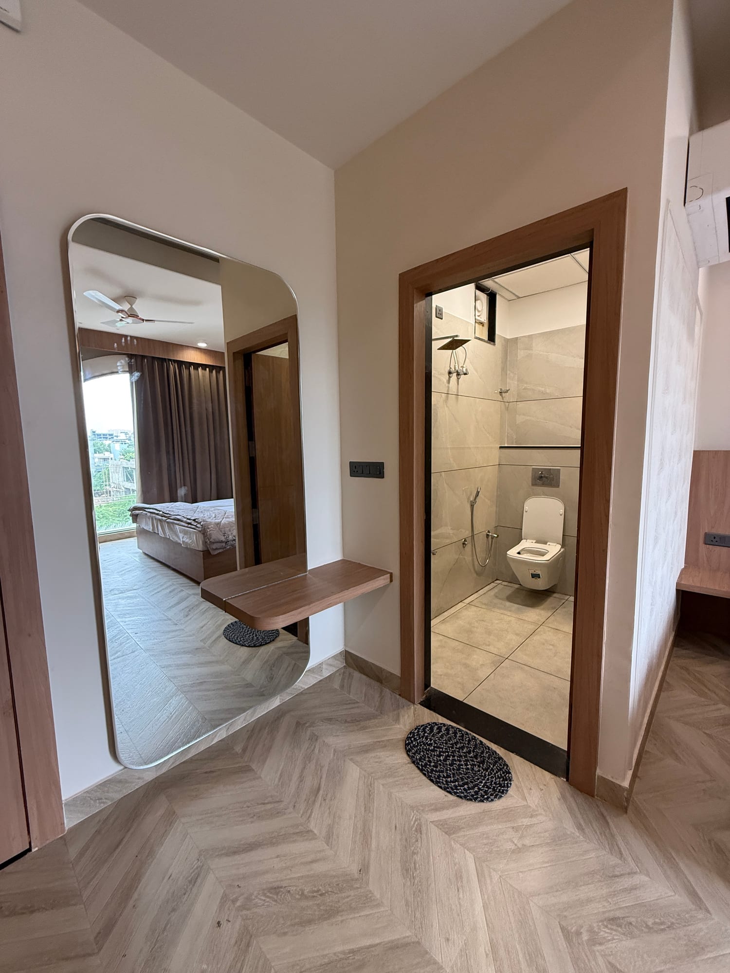 Bathroom entry and vanity mirror in a Cosmo room